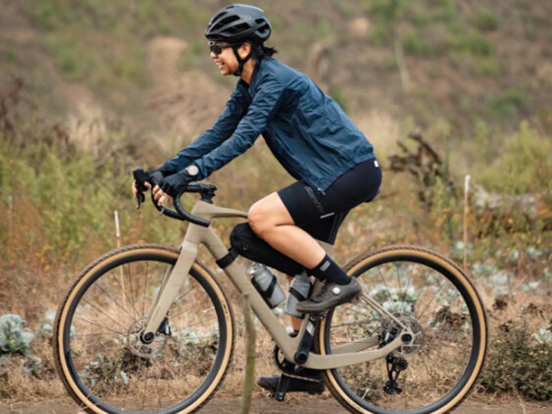 A rider going through a straight gravel track practicing her speeding skills A rider going through a straight gravel track practicing her speeding skills
