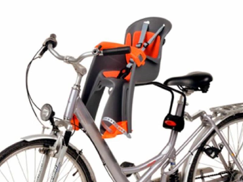 A front-mounted bike child seat on a city bike A front-mounted bike child seat on a city bike