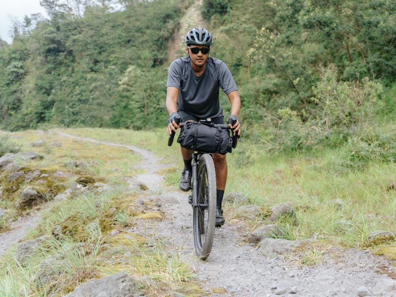 A professional cyclist starting his journey exploring the gravel track A professional cyclist starting his journey exploring the gravel track