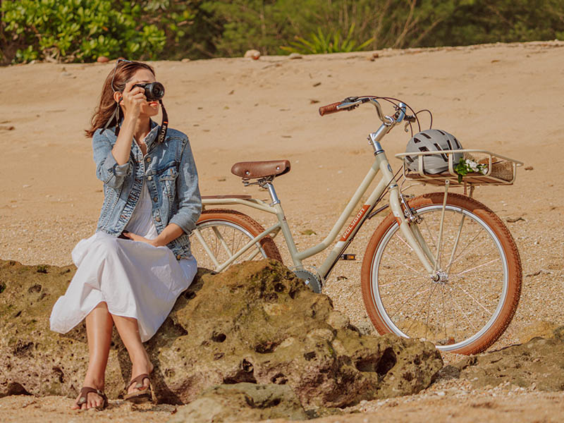 A stylish female cyclist with her lovely women bike A stylish female cyclist with her lovely women bike
