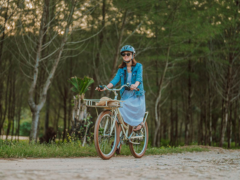 A female cyclist rides her bike around the city A female cyclist rides her bike around the city