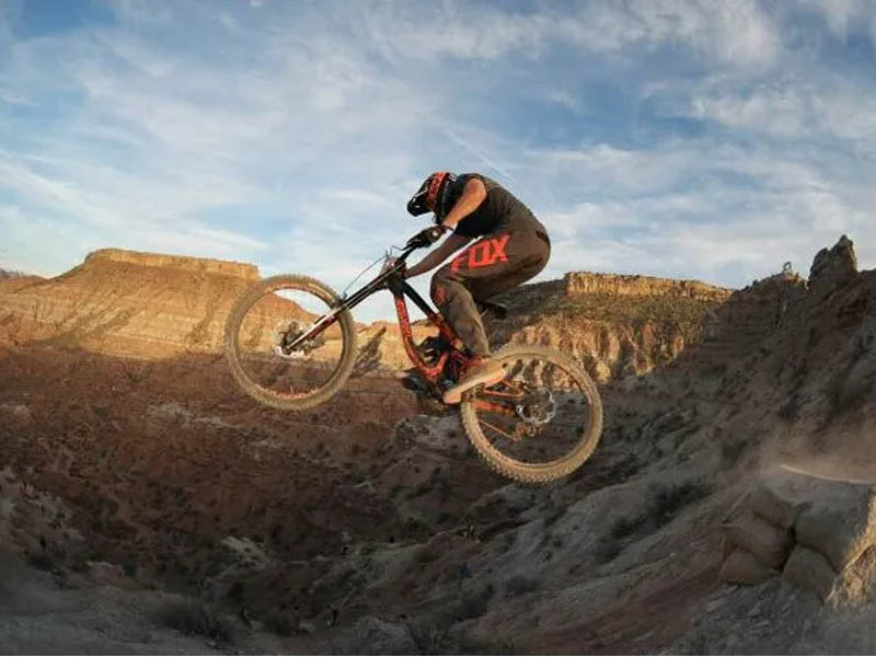 A mountain biker conquers the extreme terrain with Polygon Collosus DH9 A mountain biker conquers the extreme terrain with Polygon Collosus DH9