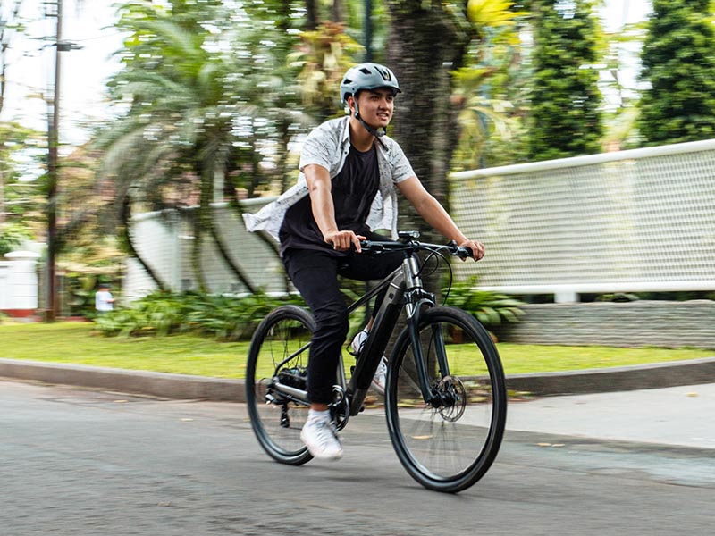 A cyclist enjoys a leisure ride with his powerful Kalosi Miles Electric Bike A cyclist enjoys a leisure ride with his powerful Kalosi Miles Electric Bike