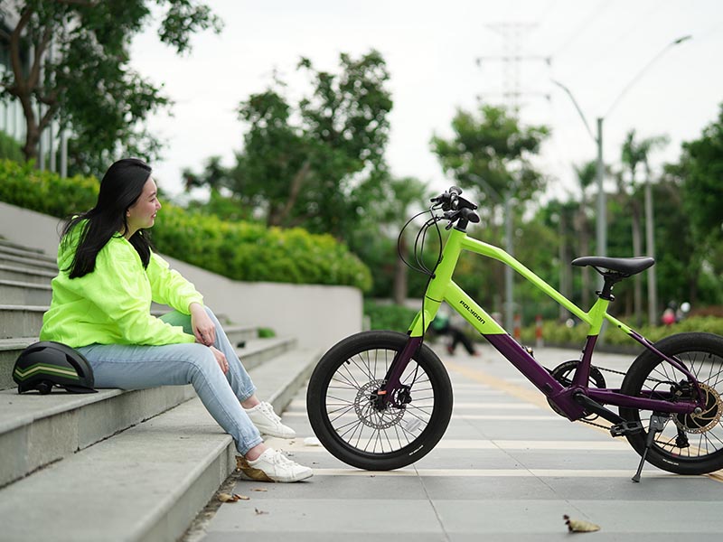 A cyclist looking at his impressive electric bicycles A cyclist looking at his impressive electric bicycles