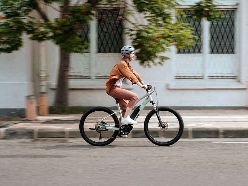 A cyclist enjoys riding with electric bike A cyclist enjoys riding with electric bike