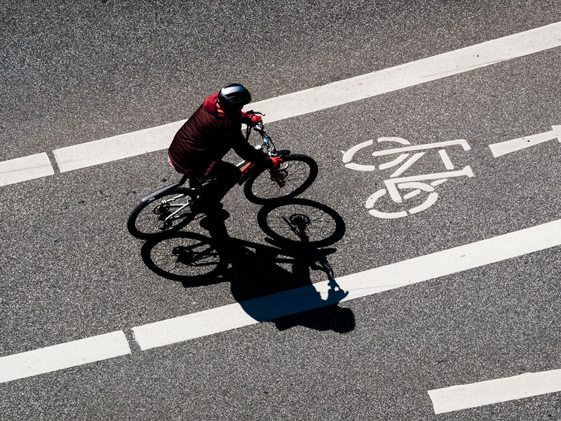 Cyclists riding through the proper bike lanes in Malaysia Cyclists riding through the proper bike lanes in Malaysia