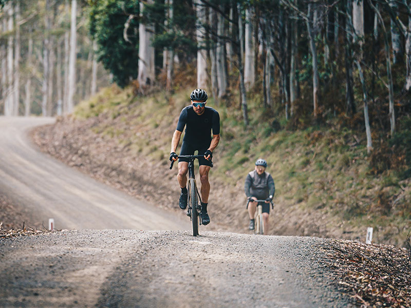 Rocky uphill tracks are easily conquered by a gravel cyclist Rocky uphill tracks are easily conquered by a gravel cyclist