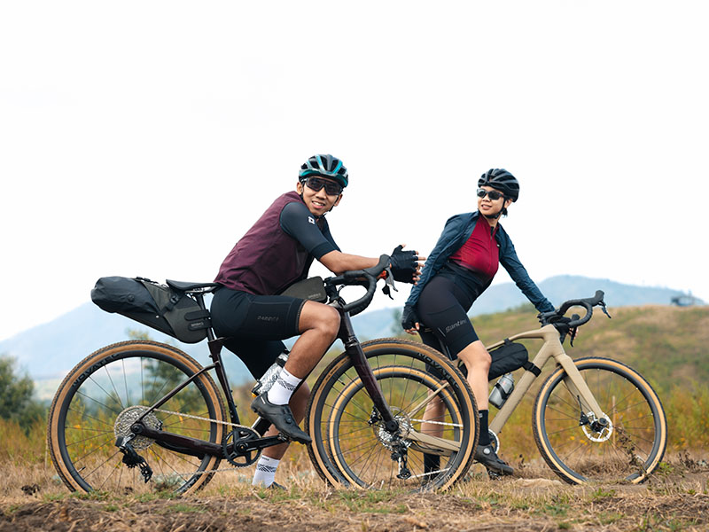 A cyclist smiles happily before taking an adventure A cyclist smiles happily before taking an adventure