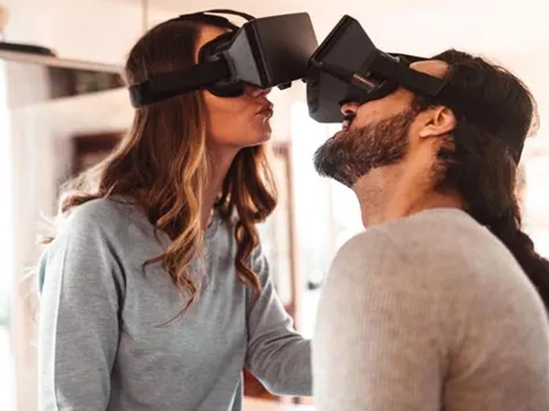 A couple playing a virtual reality game together A couple playing a virtual reality game together
