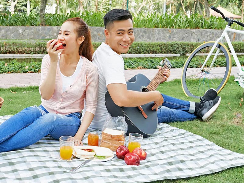 A couple enjoying romantic picnic in the park A couple enjoying romantic picnic in the park