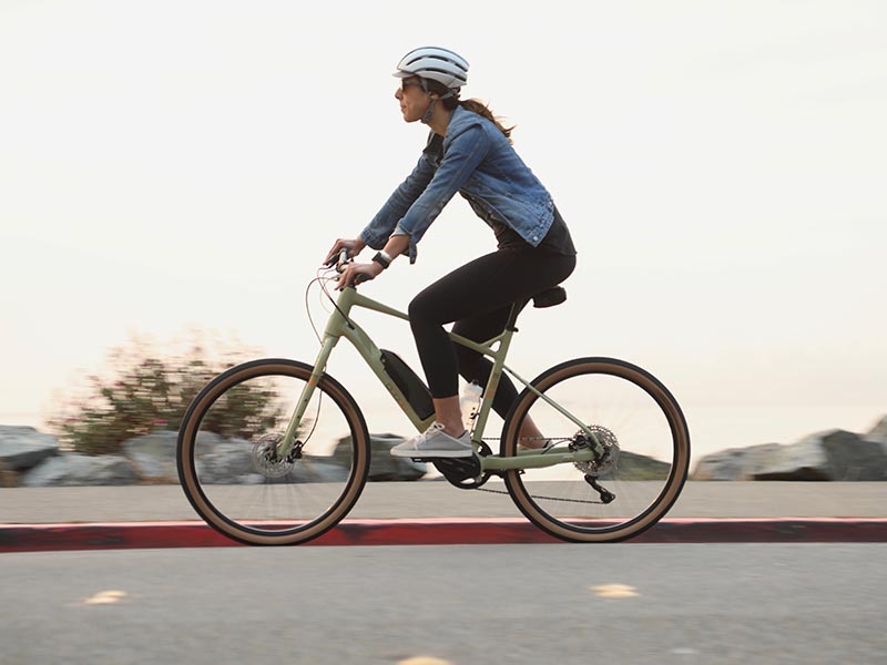 A cyclist uses an E-bike with full-set accessories A cyclist uses an E-bike with full-set accessories