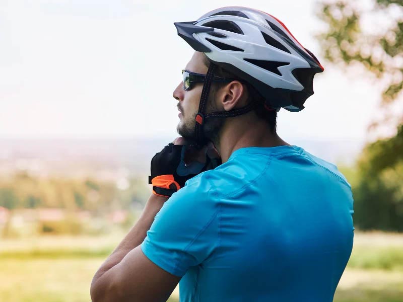 Wearing a bike helmet before a ride Wearing a bike helmet before a ride