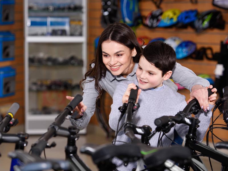 Choosing the best bicycle for kids in a kedai basikal Choosing the best bicycle for kids in a kedai basikal