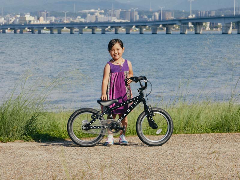 Young cyclist taking a photo with his bicycle Young cyclist taking a photo with his bicycle