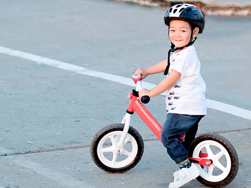 Kid with his balance bike Kid with his balance bike