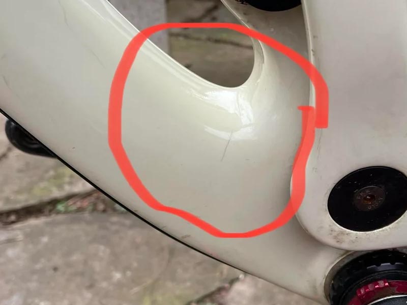 A cracked carbon mountain bike frame A cracked carbon mountain bike frame