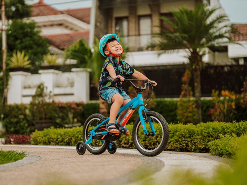 Riding a children's bike in the parks Riding a children's bike in the parks